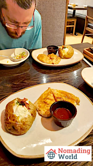 Chicken on the barbie, jacket potato, and El Ranchito Salad from Outback Steakhouse in Brazil.